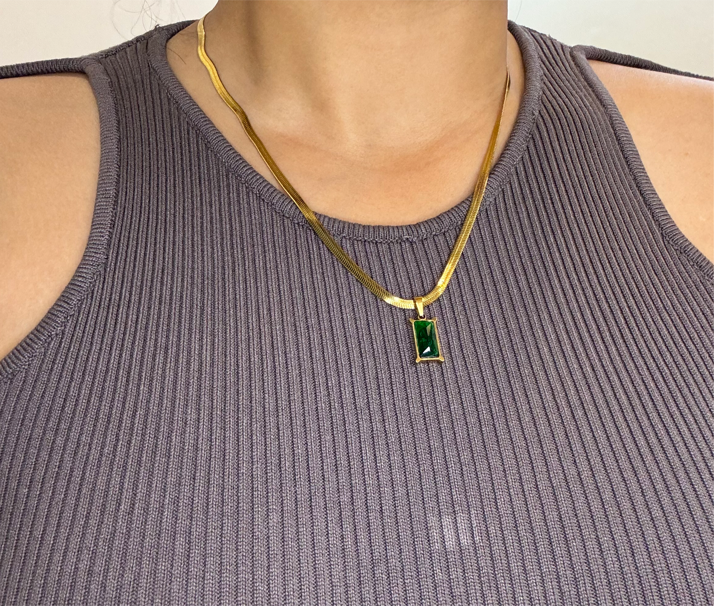 Green crystal charm with snake bone chain