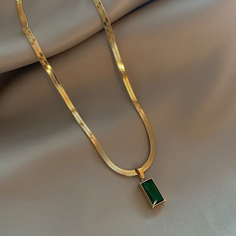 Green crystal charm with snake bone chain