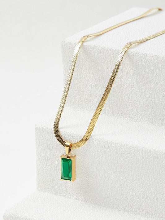Green crystal charm with snake bone chain